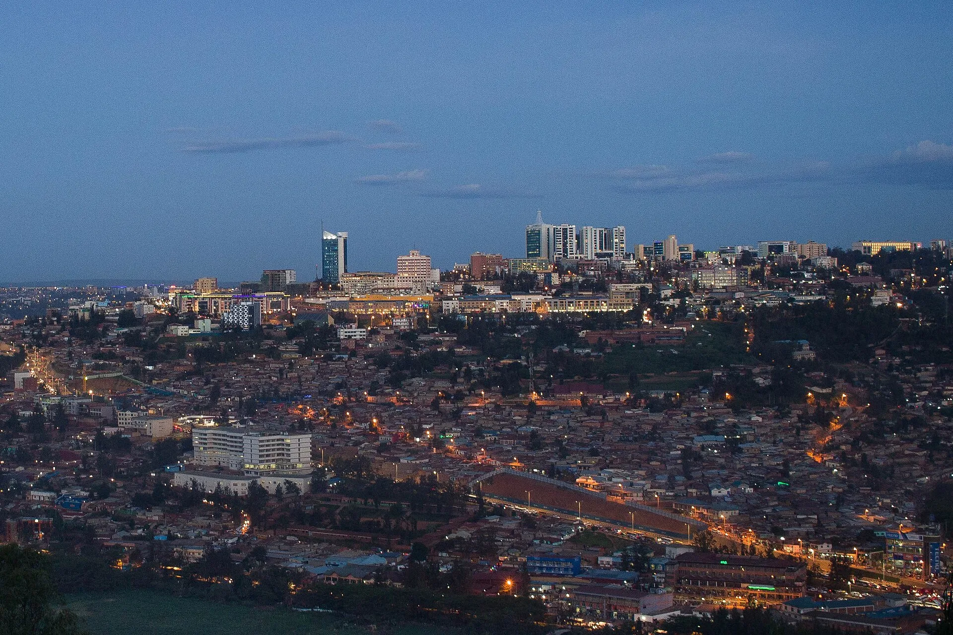 Kigali city centre and its hills lit up at dusk