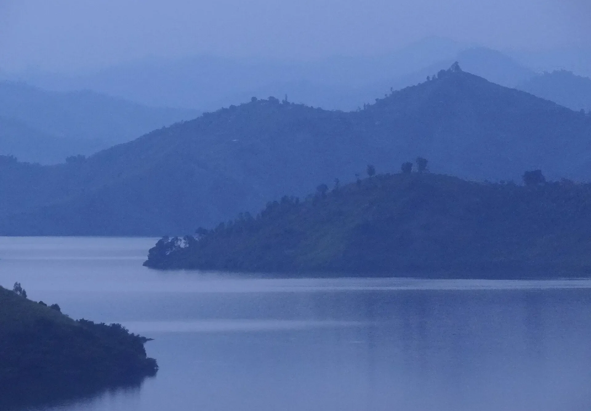 Lake Kivu and its forested islands at dusk near Kibuye, western Rwanda