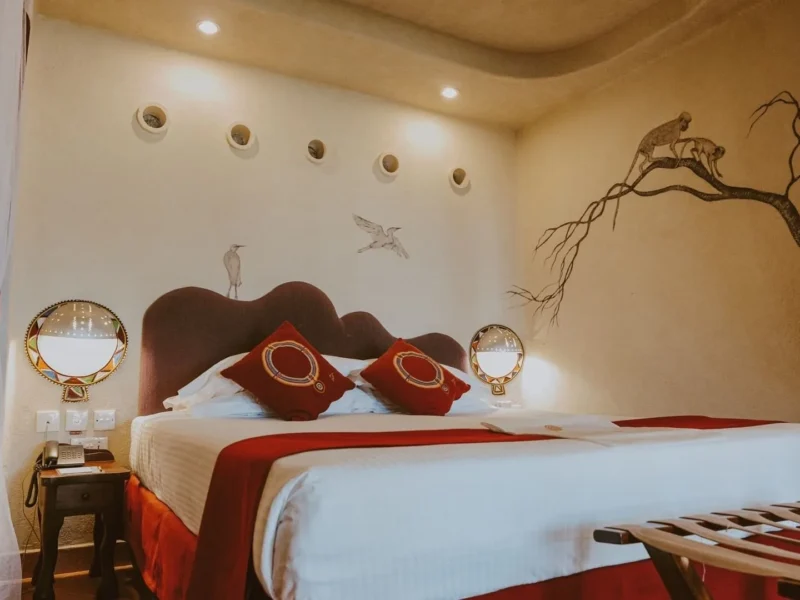 Double room with Maasai-inspired murals at Amboseli Serena Safari Lodge