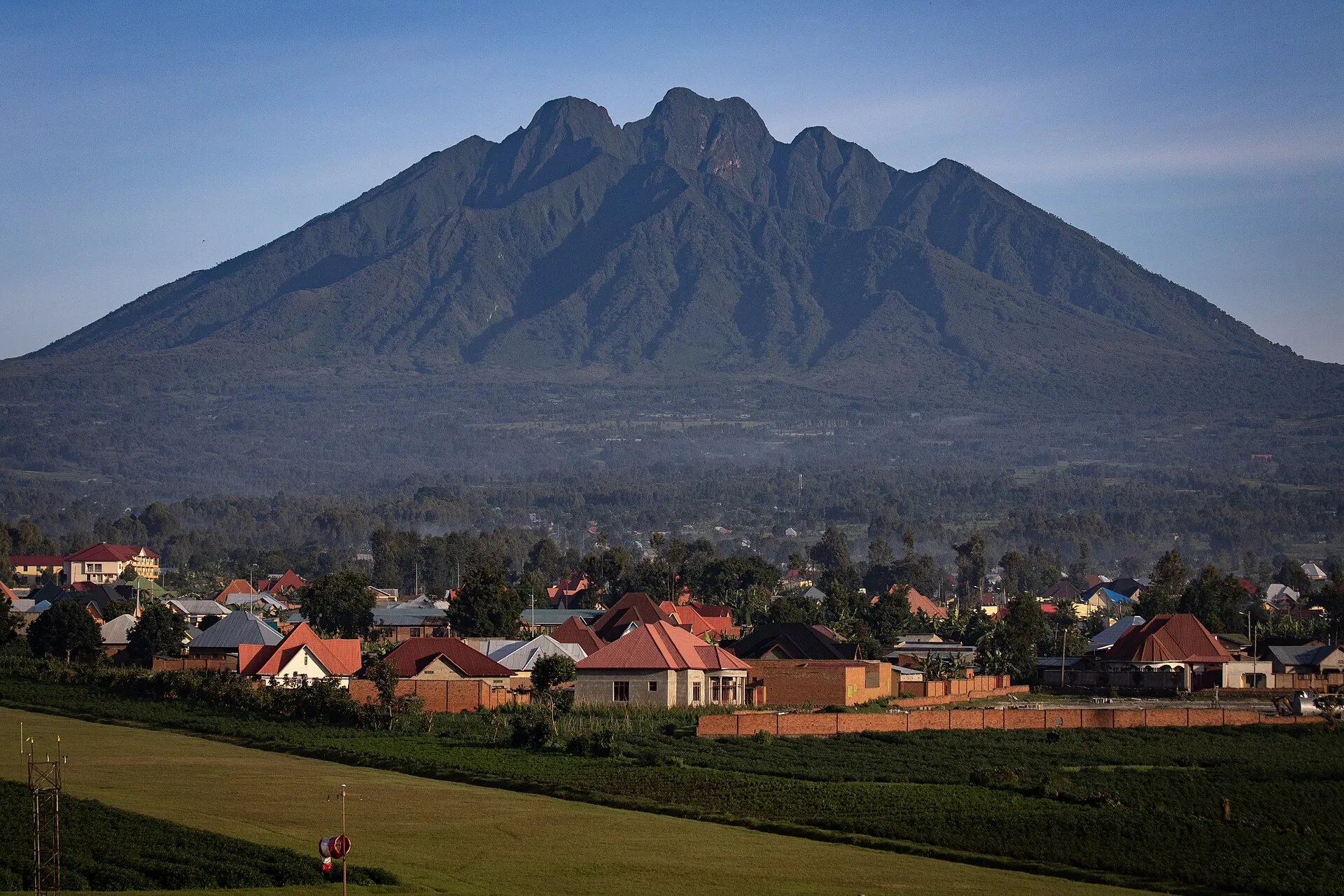 Sabyinyo volcano rising behind the town of Musanze, gateway to Volcanoes National Park
